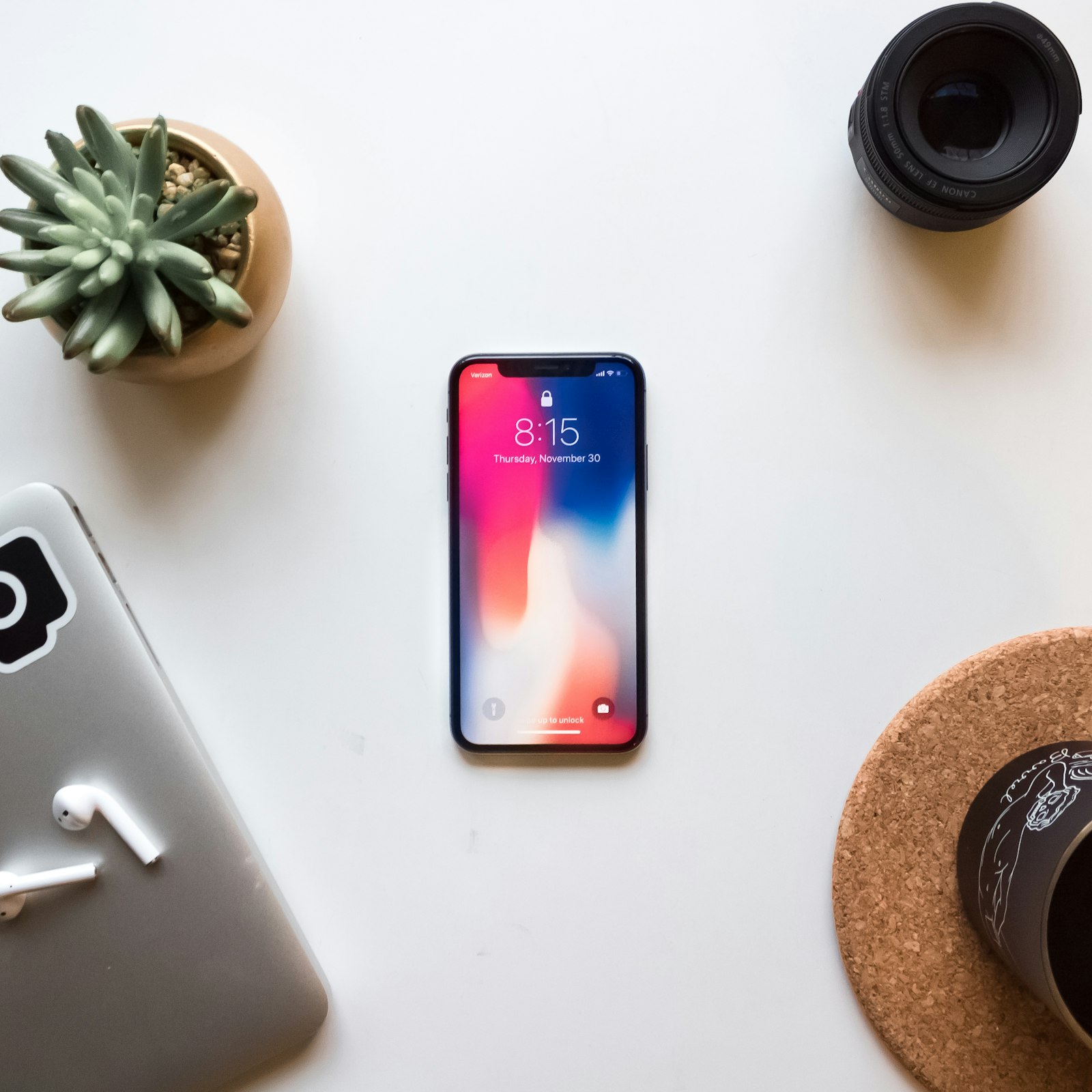 Hands holding a phone showing a photo gallery